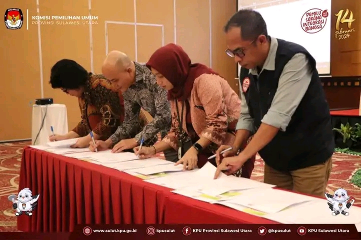 PEMILIH SEMENTARA: Komisioner KPU Sulut saat menandatangani berita acara pleno.