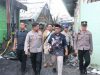 Kapolresta Salurkan Bantuan dan Hadirkan Pemeriksaan Kesehatan Gratis