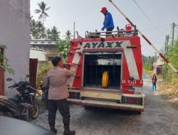 Polsek Mapanget dan Damkar Bergerak Cepat Padamkan Kebakaran Lahan di Perumahan GPI Buha